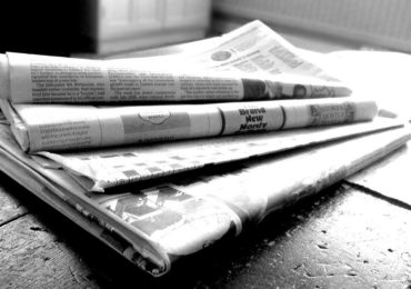 Photograph of newspaper pile